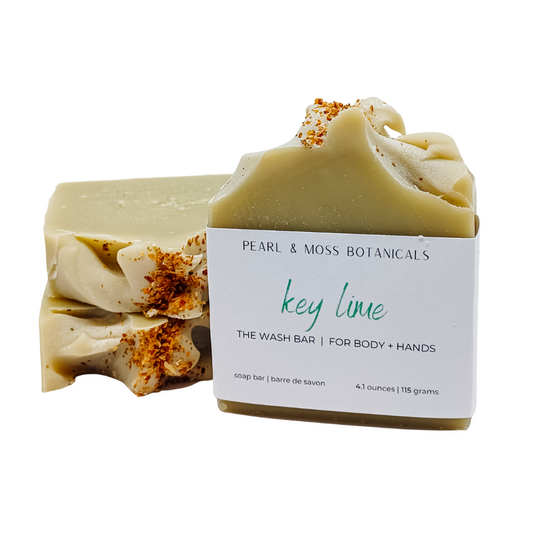 The smell of every beachfront vacation, the Key Lime WASH Bar boasts the fresh and fruity smells of key lime. Uplifting, energizing and playful, the Key Lime bar is a perfect round out to any collection.  Naturally coloured with French green clay, turmeric powder and indigo powder, this beautifully simple green bar is topped with dried lemon peel for an extra hint of citrus.